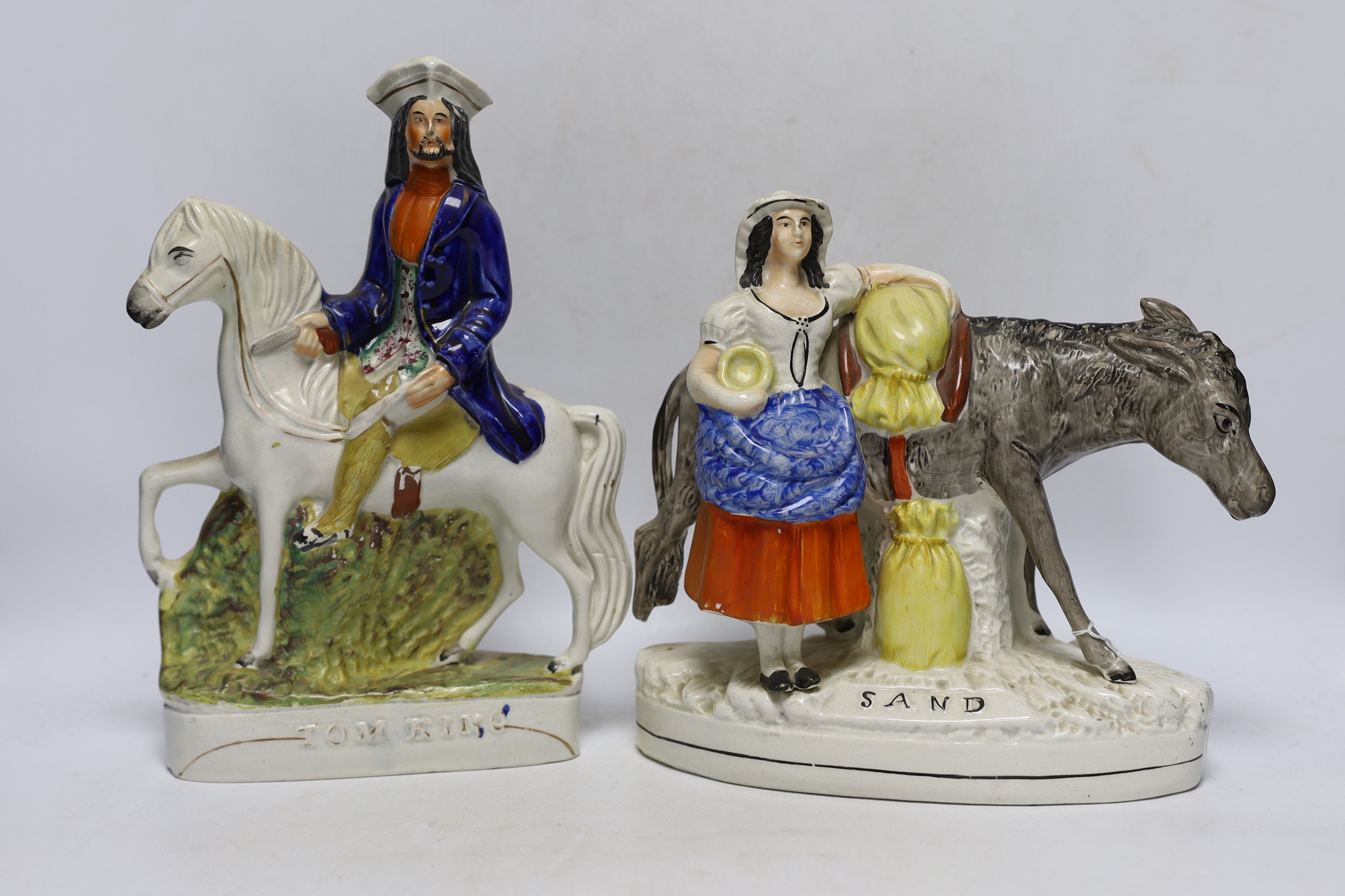 Three mid 19th century Staffordshire figure groups including Dick Turpin, Tom King and Sand, tallest 30cm